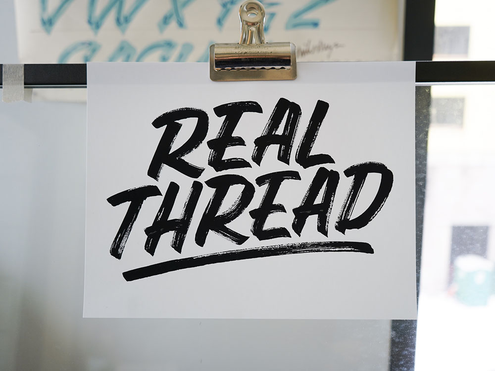 real thread hand letting clipped onto wall divider