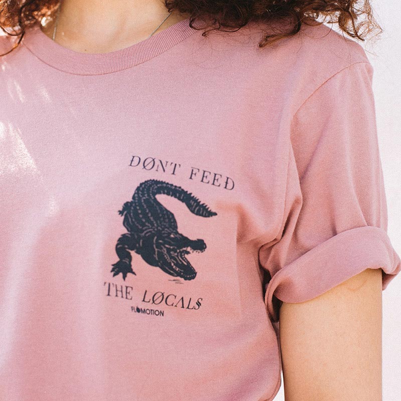 girl wearing pink shirt with black breast graphic