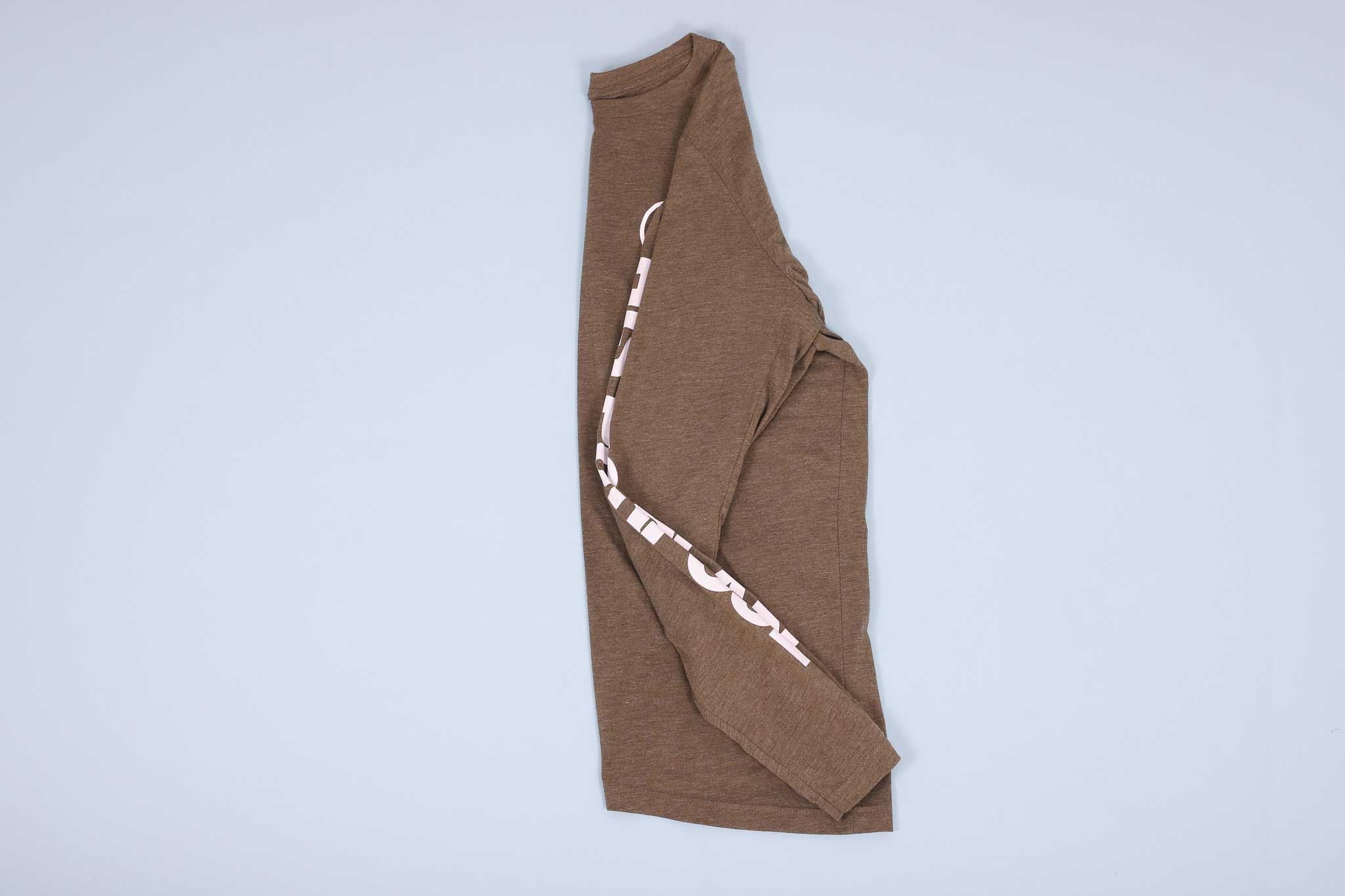 Olive long sleeve t-shirt folded in half with sleeve folded into the shirt